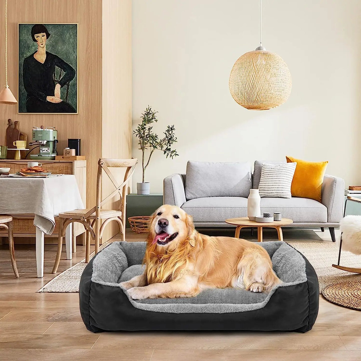 Golden retriever lying comfortably in a plush, gray dog bed, looking relaxed and cozy with its head resting on the edge of the bed.